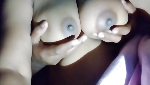 Indian woman masturbates and gives a massage to herself