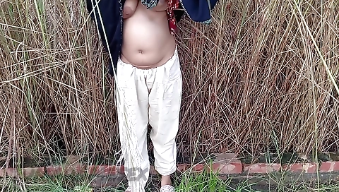 Hot indian housewife driving in the woods outdoors