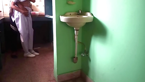 Indian college brunette is sitting on the bed in a very hot village