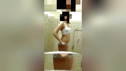 Indian girl in a homemade shower in her natural body