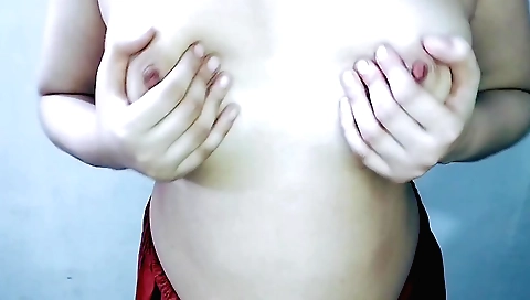 Solo female in black and white dresses in webcam video