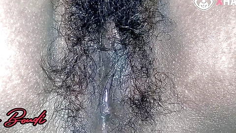 Busty naked girl with sexy face with a hairy pussy