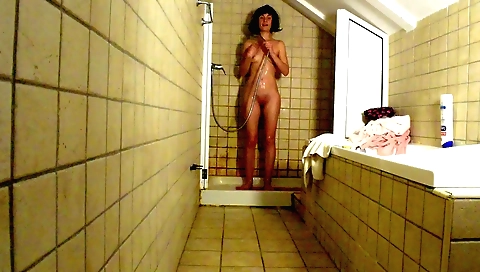 Indian solo girl plays in the shower and masturbates