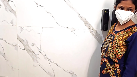 Amateur brunette girl in a white dress uses the bathroom