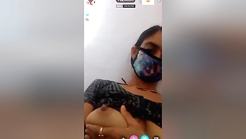Indian beauty with small tits fucks herself on webcam