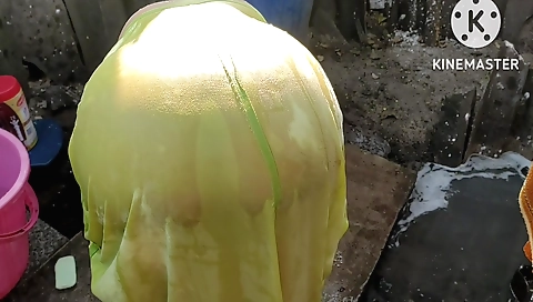 Chubby brunette is naked on the grass and masturbating