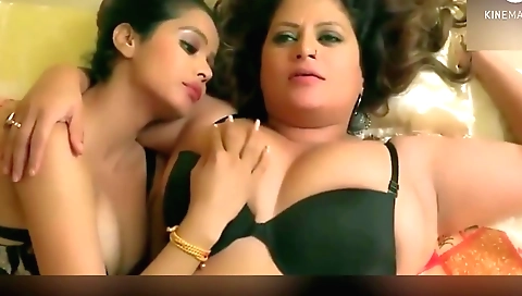 Indian hottie and her younger friend are having fun on the bed